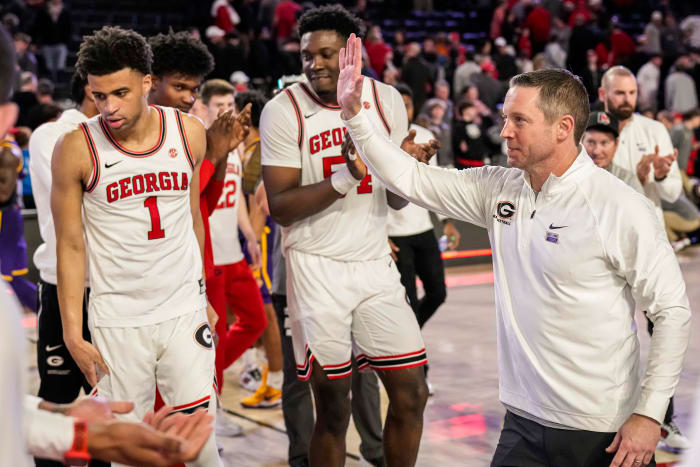 Jan 24, 2024; Athens, Georgia, USA; Georgia Bulldogs head coach Mike White (right) reacts with his players after defeating the LSU Tigers at Stegeman Coliseum. Mandatory Credit: Dale Zanine-USA TODAY Sports